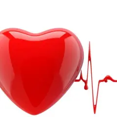 Czerwone serce na tle linii EKG, symbolizujące arytmie i zdrowie serca.
