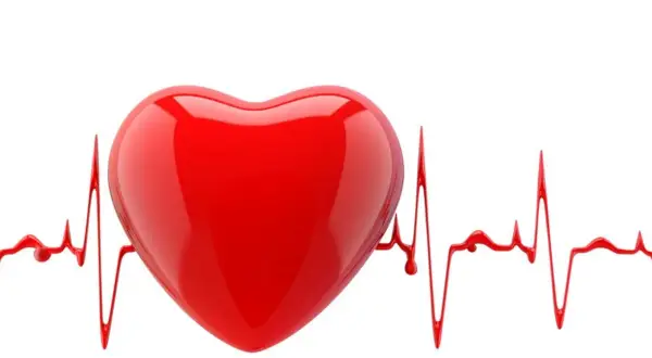 Czerwone serce na tle linii EKG, symbolizujące arytmie i zdrowie serca.